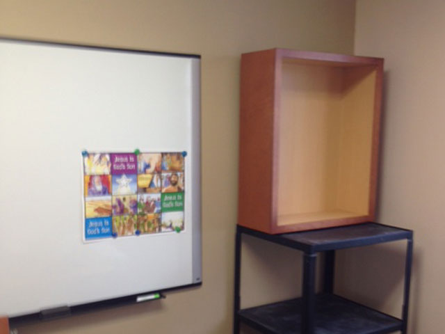 Classroom cabinet getting ready to be installed